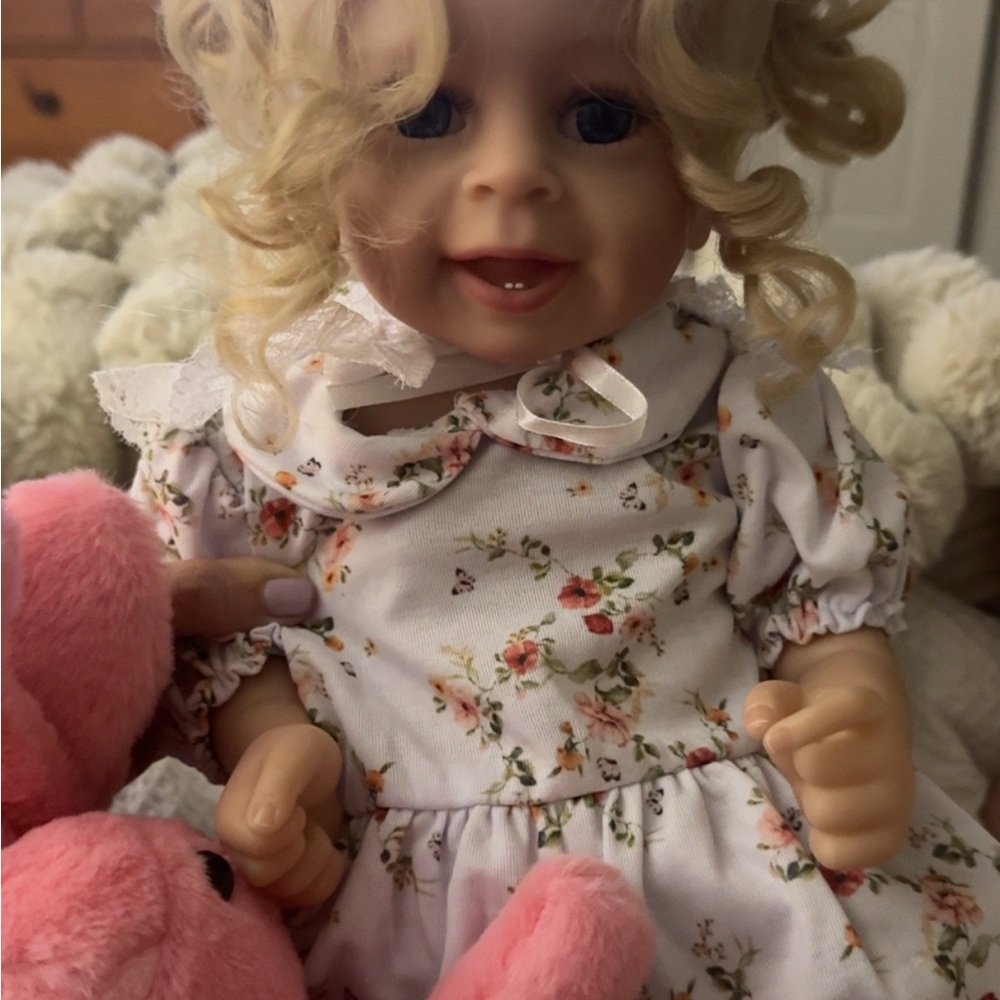 Reborn baby doll with pink bear and bottle.  Brand new in box.  Took out for pic